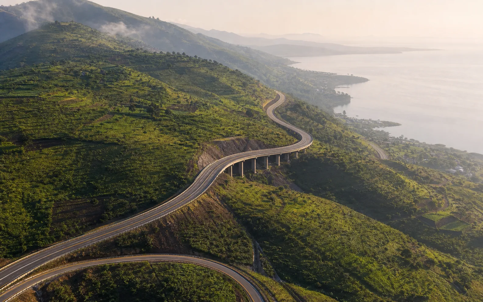 Aerial view of a highway through highland terrain